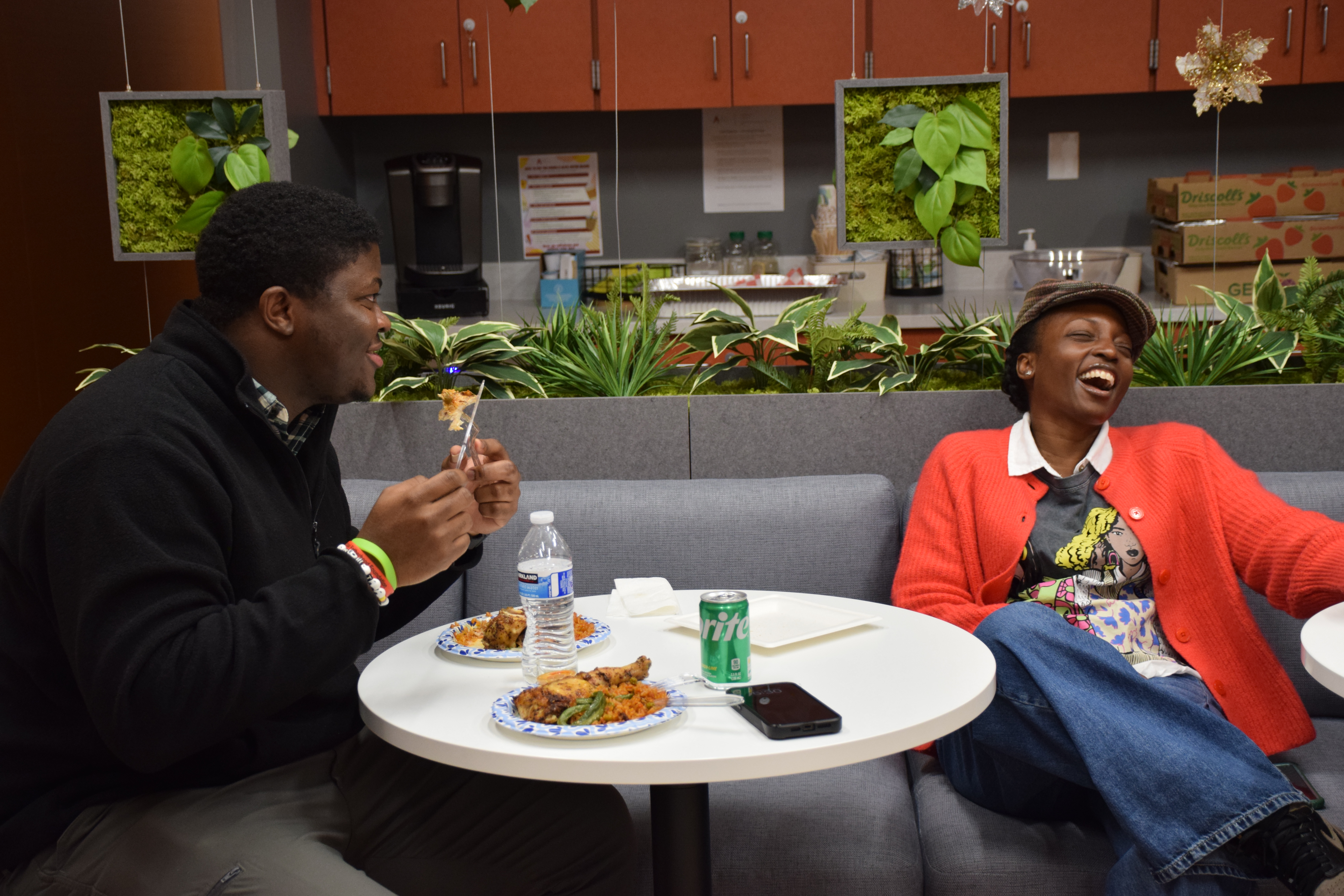 Denise and Emmanuel having a spirited conversation with other community members